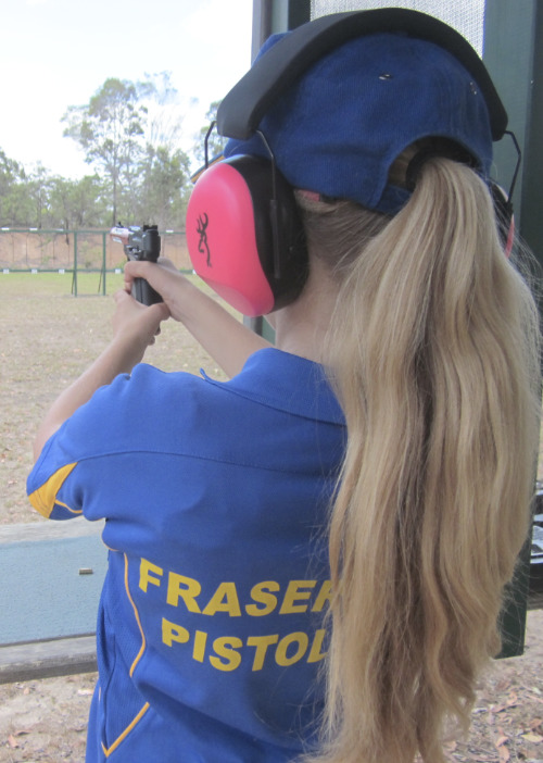 young girl shooting a target at the fraser coast pistol club - hervey bay shooting range